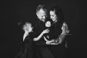 black & white newborn family photo, mom, dad, big sister, newborn sister wearing black Lexington, SC best newborn photos