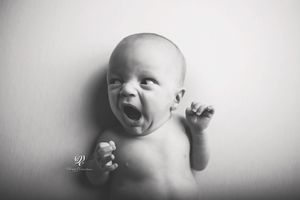Funny black & white newborn baby photo; newborn photographer; best photographer Lexington, SC; South Carolina studio