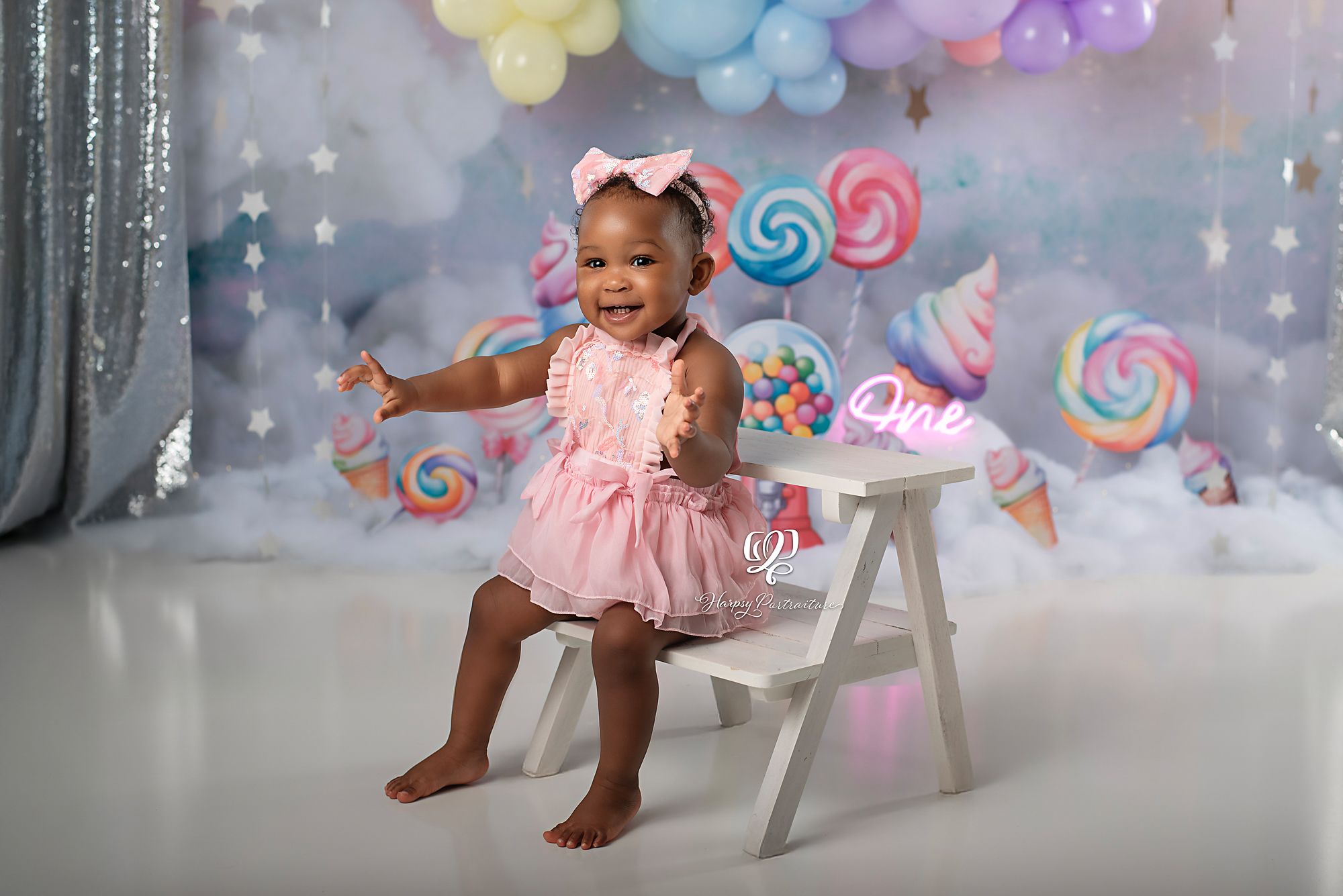 Cake Smash photoshoot first birthday session with pastel candy colors, balloons, clouds; best professional photographer Lexington, SC