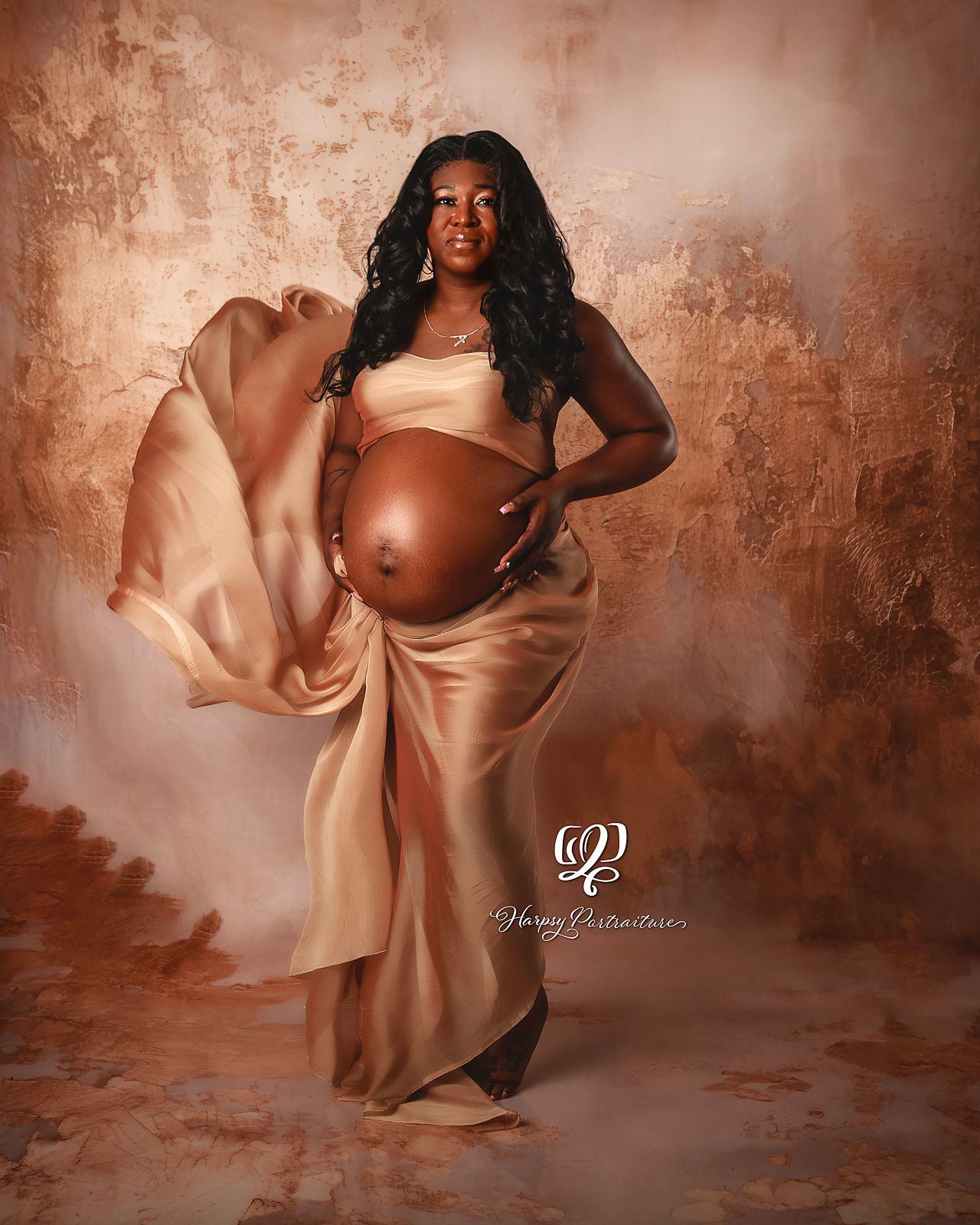 Stunning pregnant mama wearing gold fabric with floating train professional portrait studio maternity session in Lexington, SC photoshoot