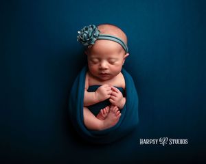 Professional newborn photography studio Lexington, SC, Midlands, SC, Columbia, SC; jewel-tone colors; baby girl in blue with flowers