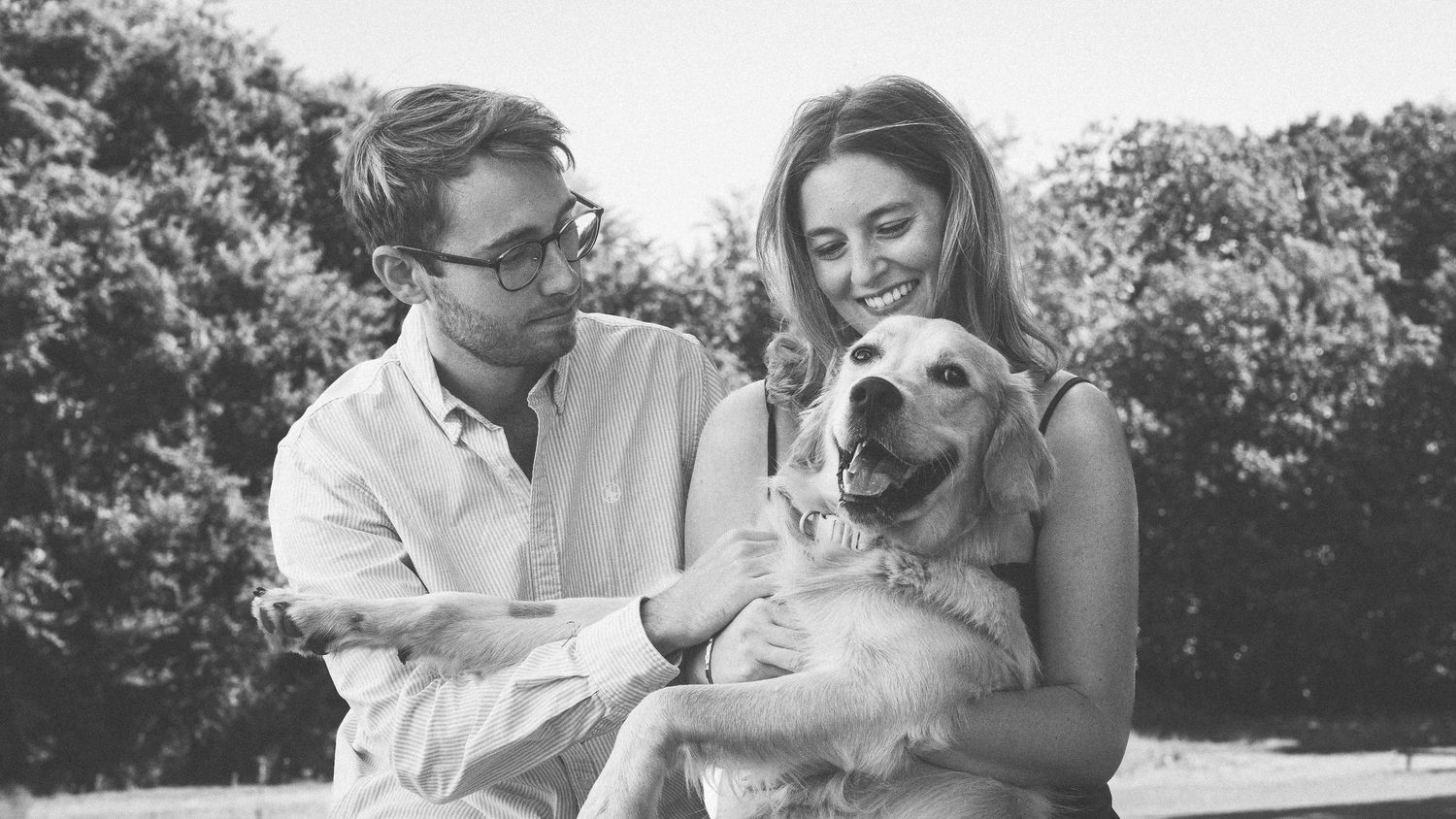 Intimate black and white portrait of couple embracing.