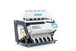 Industrial colour sorting machine with multiple chutes and advanced optical sensors for automated material separation.