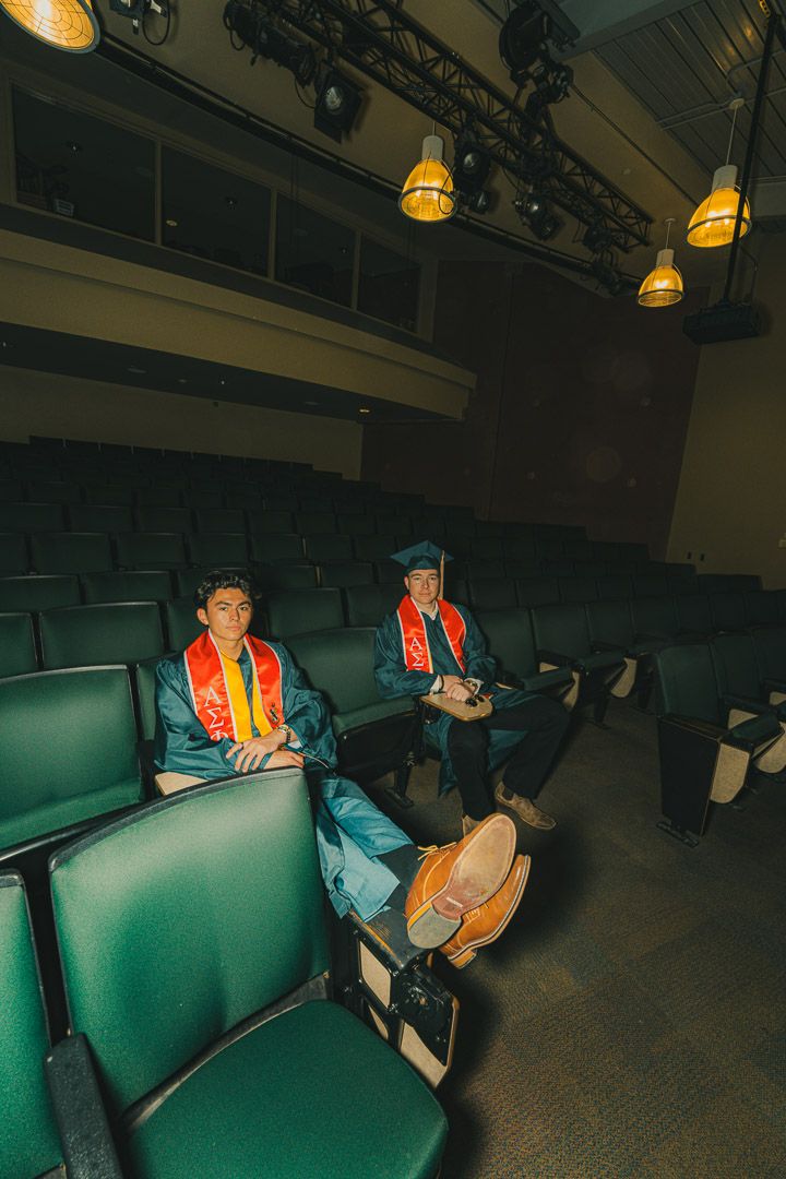 Artistic photo sequence showing movement across turquoise colored theater seating in dim lighting.