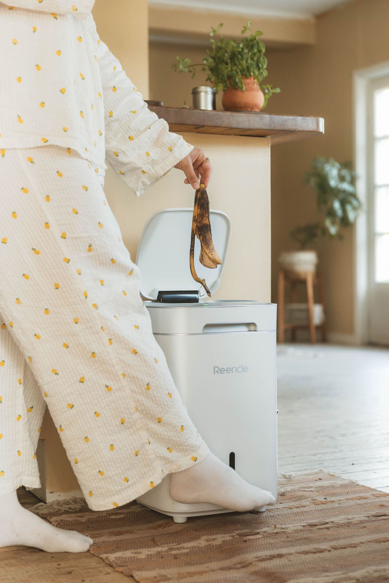 White fabric with yellow dots draping softly near a Berkey water filter system on a wooden surface in a bright room.