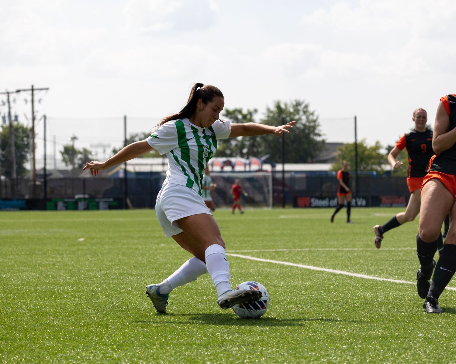 Soccer players diving on field in sequence of action shots showing goalkeeping and defensive moves during match.