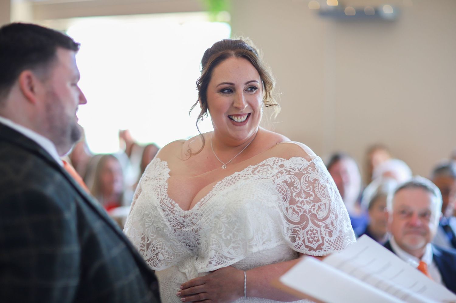 Wedding ceremony in progress showing readings and special moments in a church setting.