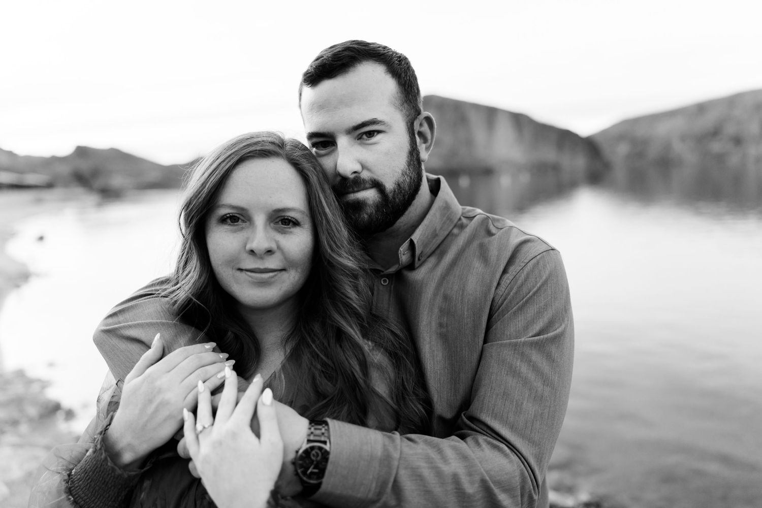 Black and white romantic portraits captured against a scenic mountain backdrop.