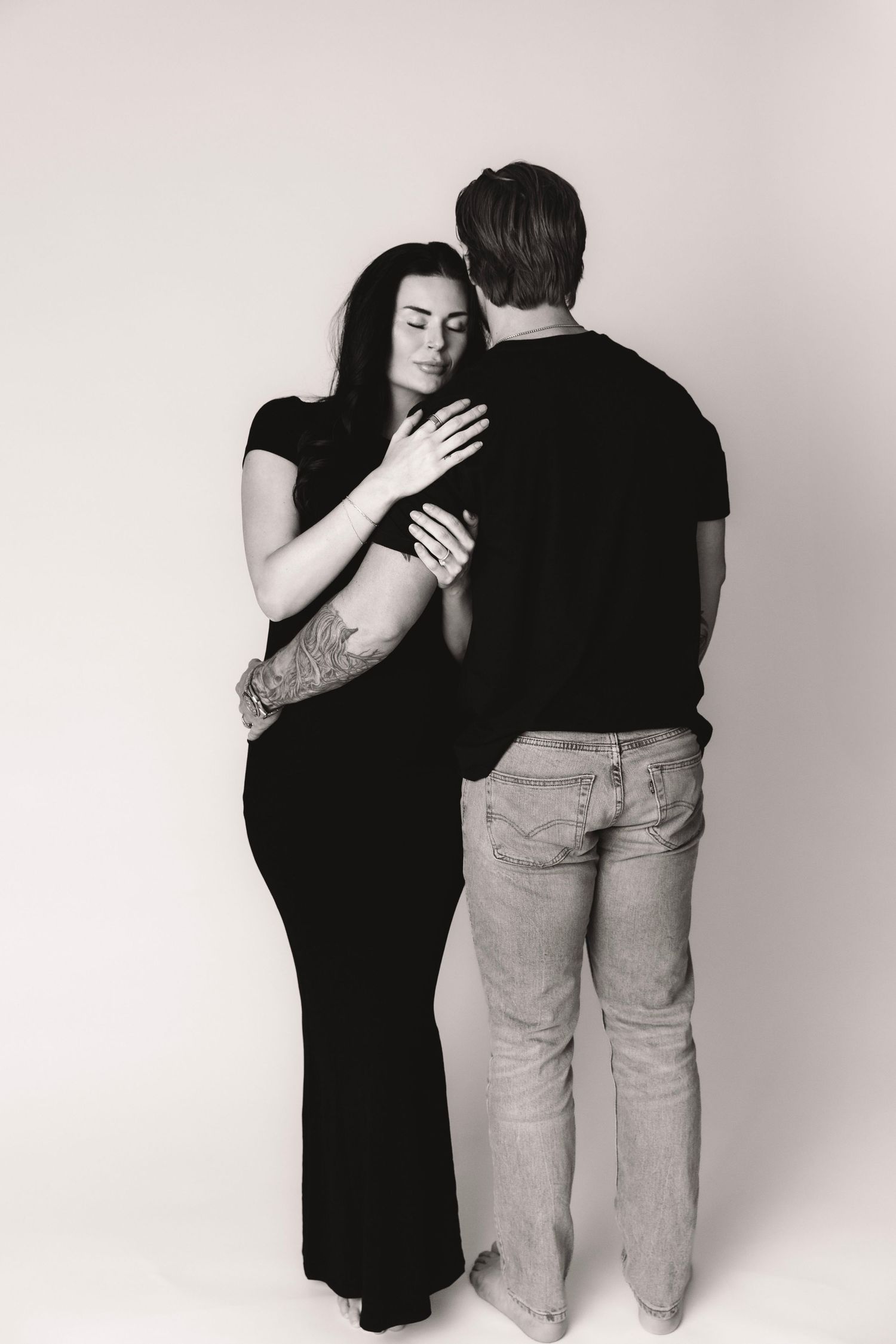 High-end studio maternity photography with elegant posing