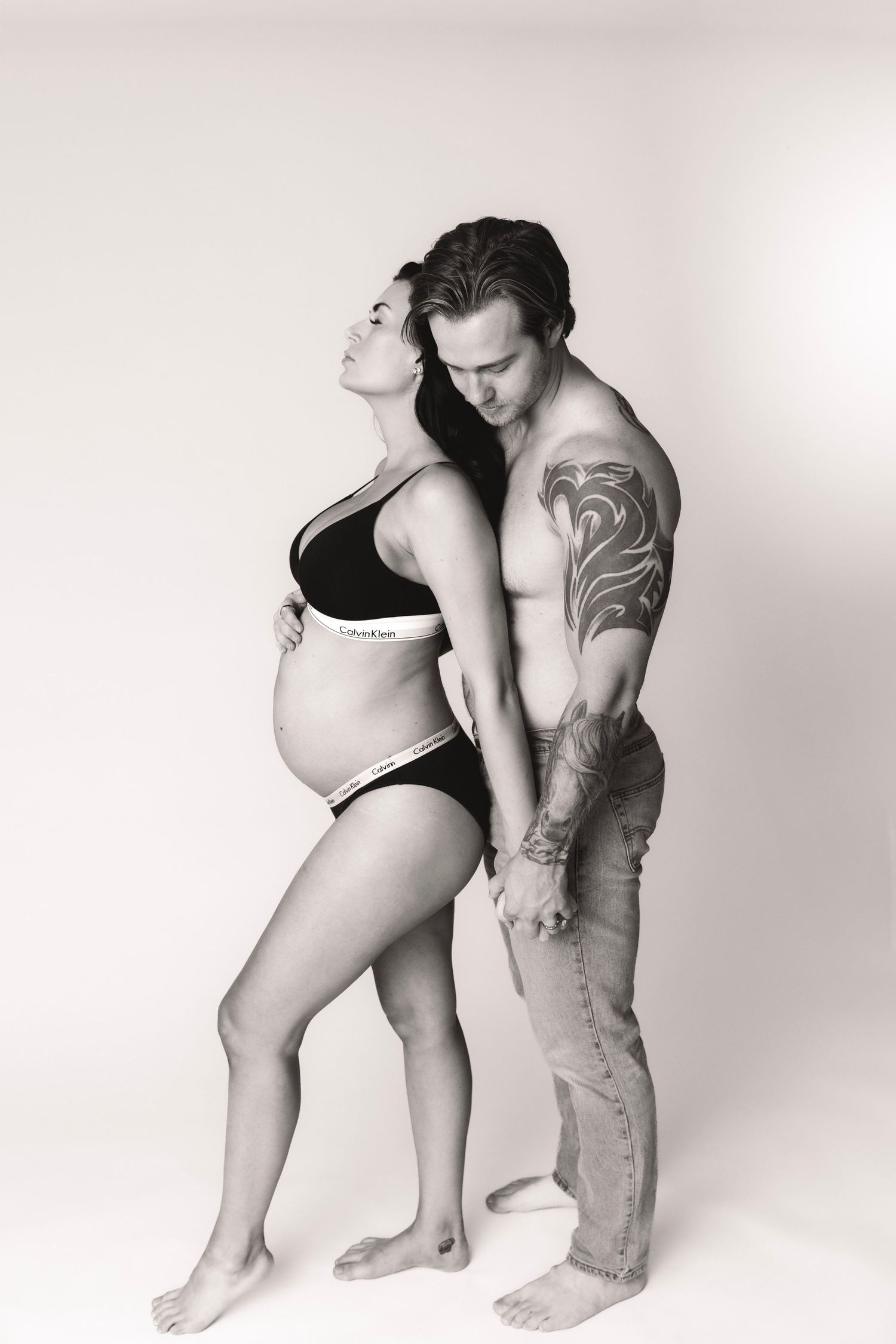 High-end studio maternity photography with elegant posing