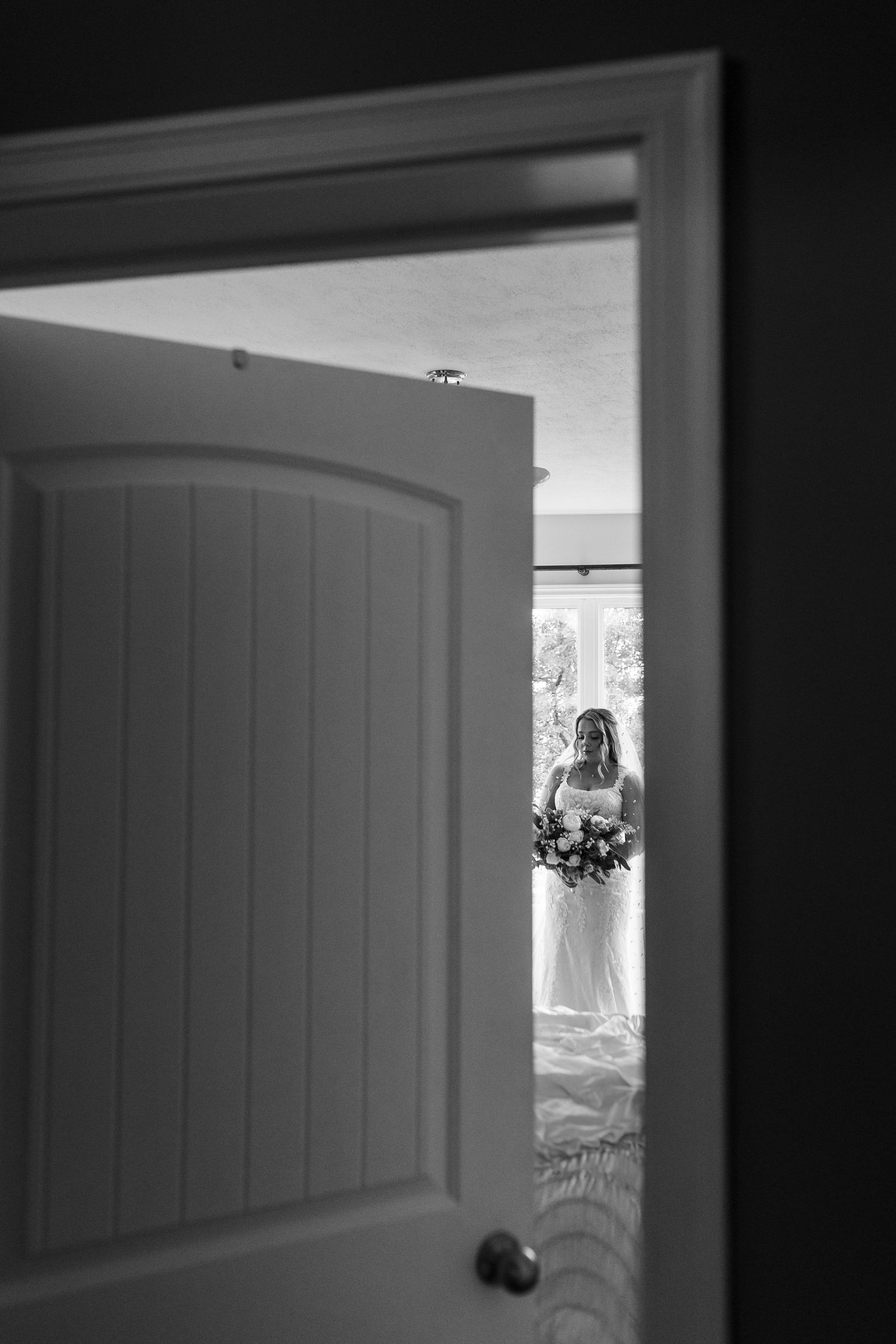A series of interior doorways creates a dramatic architectural perspective with light filtering through the frames.