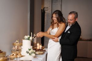 Four sequential images capture a couple putting finishing touches on their wedding dessert and refreshment table display.