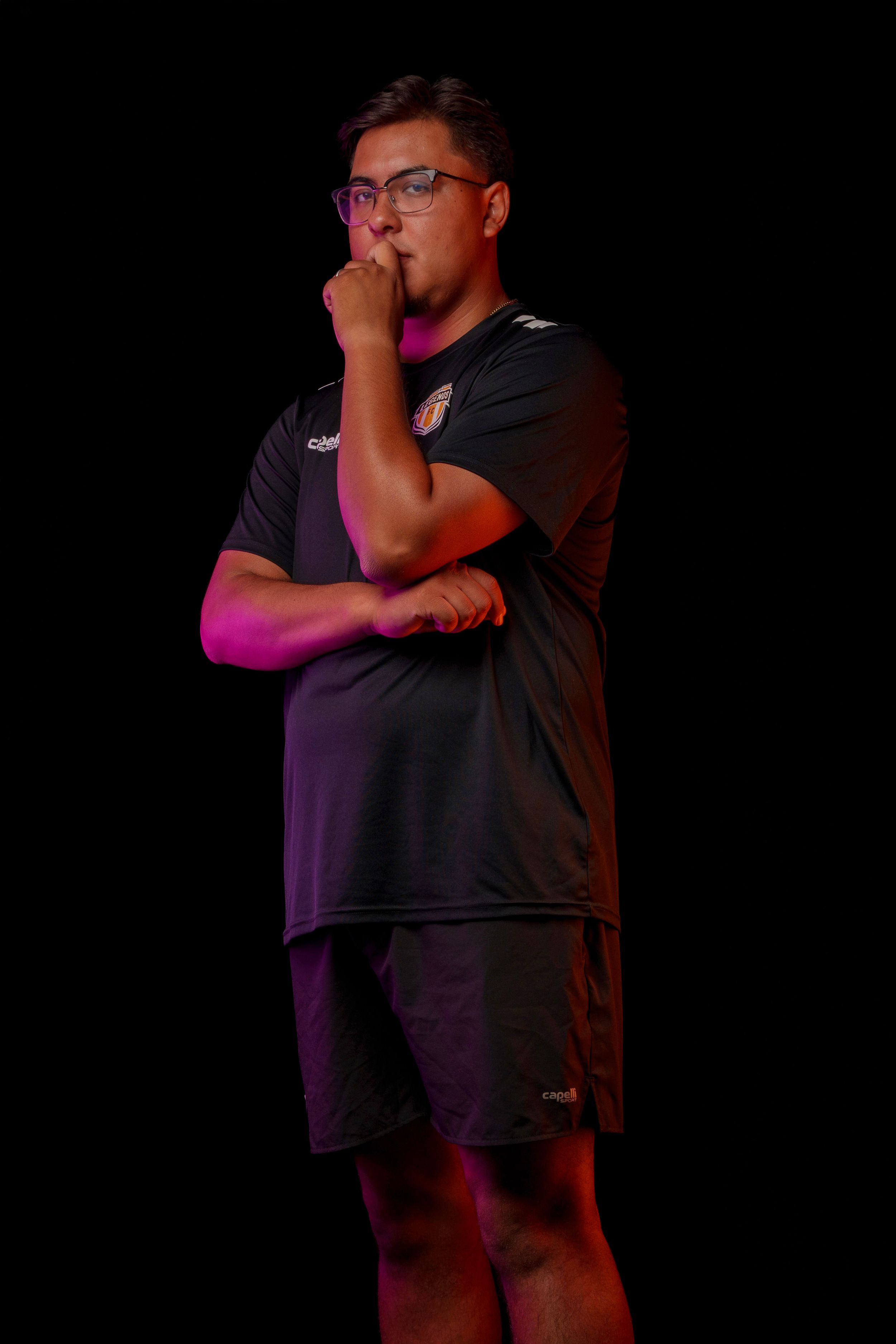 Dark portrait photo session of soccer Coach with dramatic red and blue lighting effects.