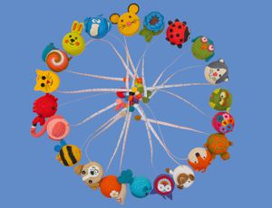 Colorful circle collage of knitted animals and objects, including a bee, ladybug, and snail made into a decorative wreath.
