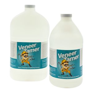 Multiple bottles of Veneer Tamer product with teal and white labels showing a cartoon lion mascot displayed in a row.