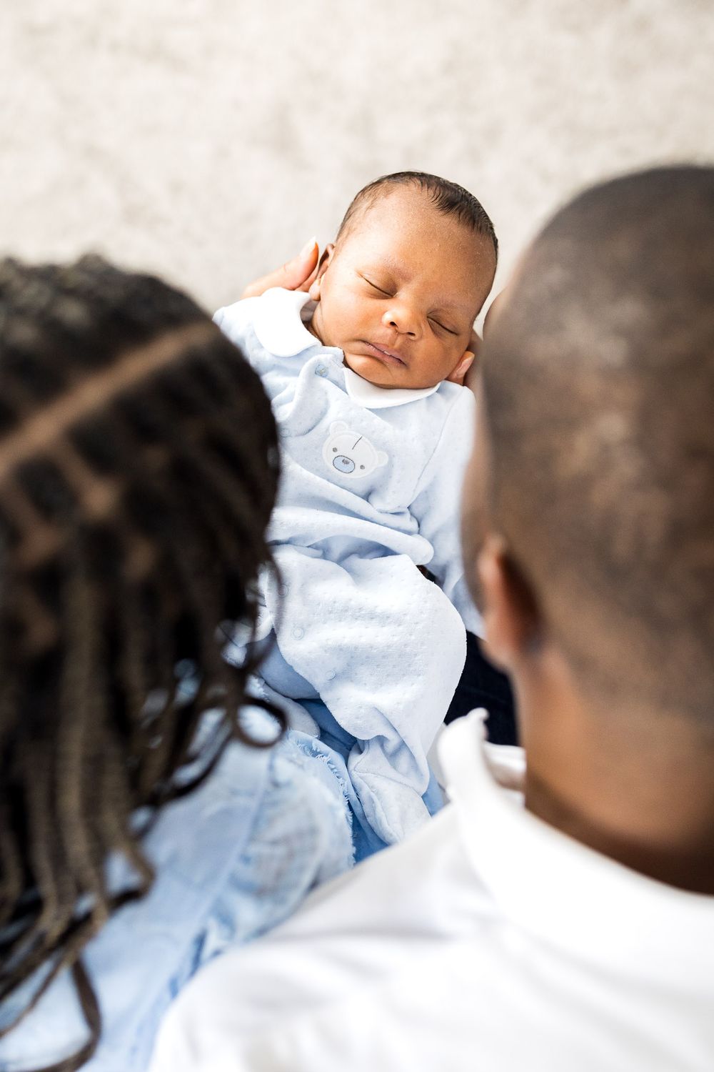 Newborn baby boy viewed from above the parents heads