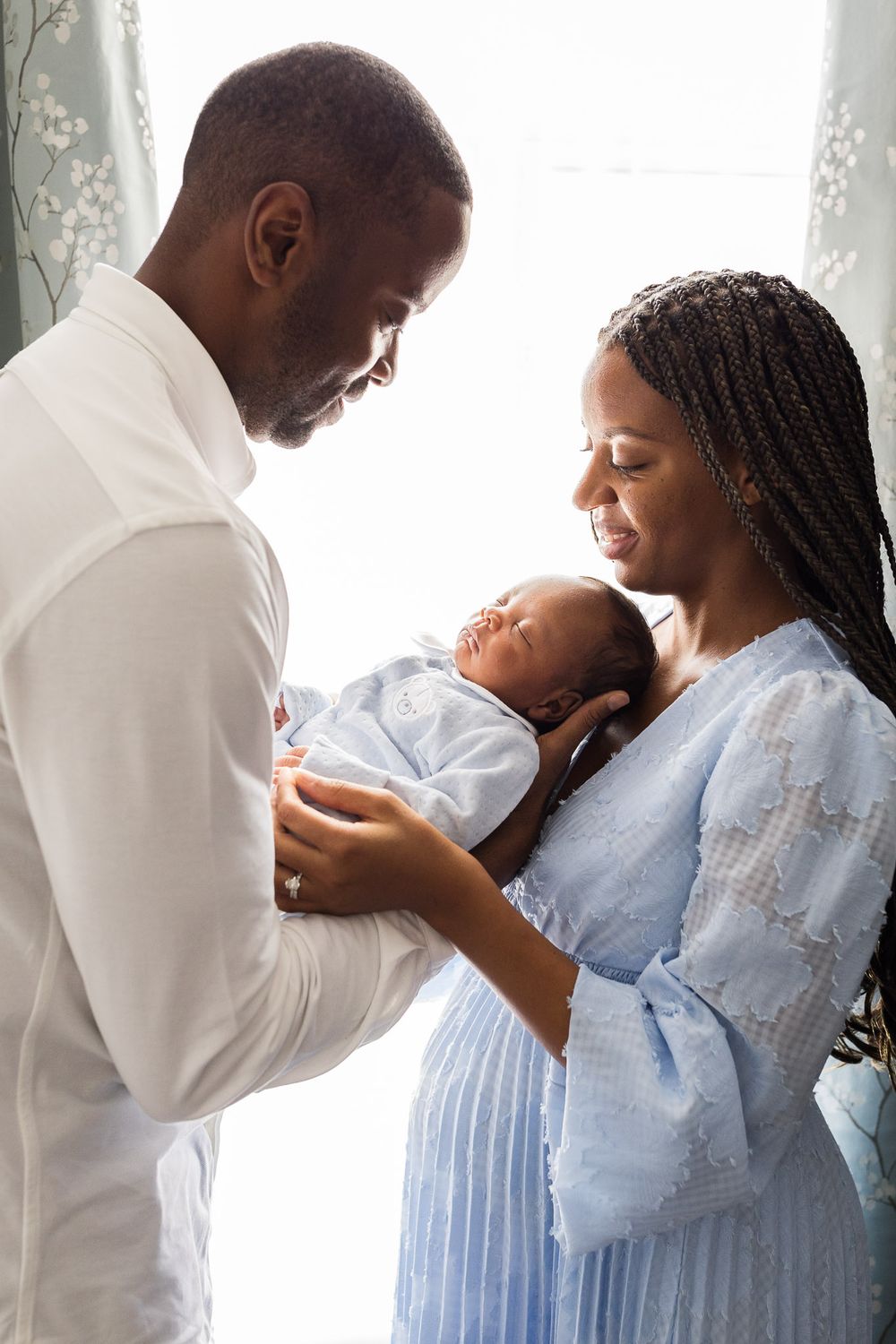 Classic portrait of parents with their newborn baby boy
