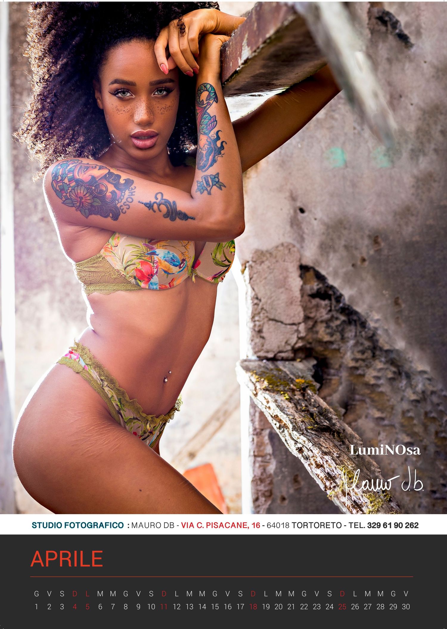 Calendar page featuring artistic fashion photography with vibrant colors and dramatic lighting.