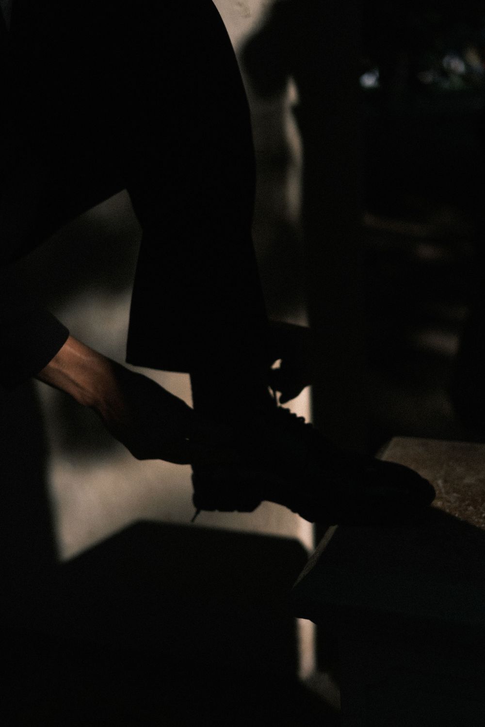 Dramatic dark composition with subtle light and shadow interplay.
