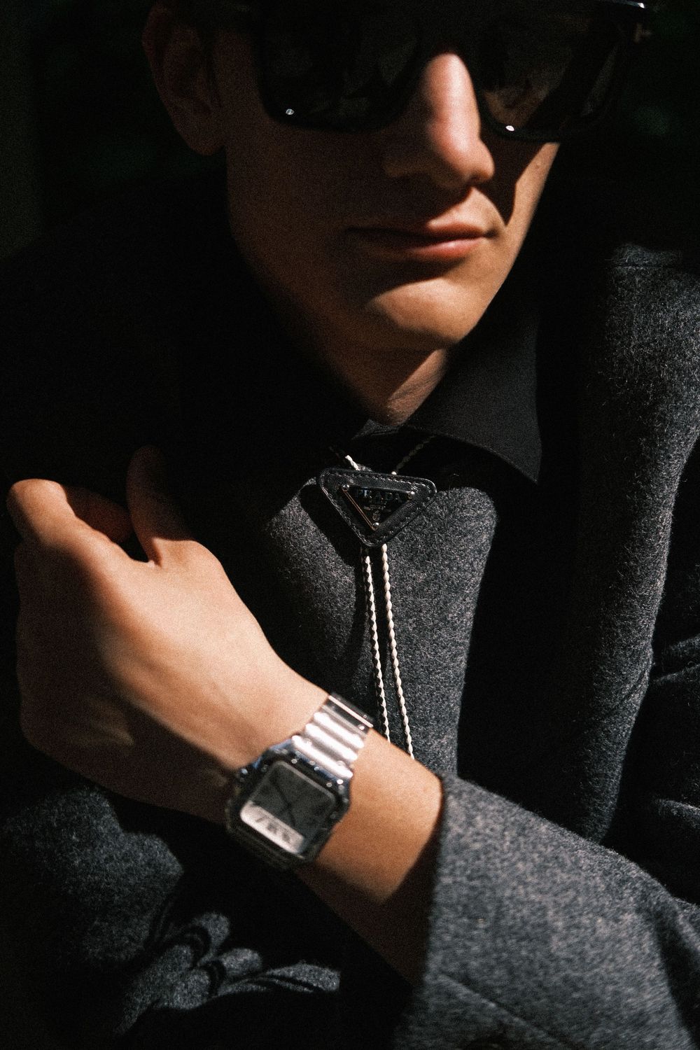 Moody cropped photo of male model in luxury menswear fashion editorial by Milan photographer Sydney Duncan.