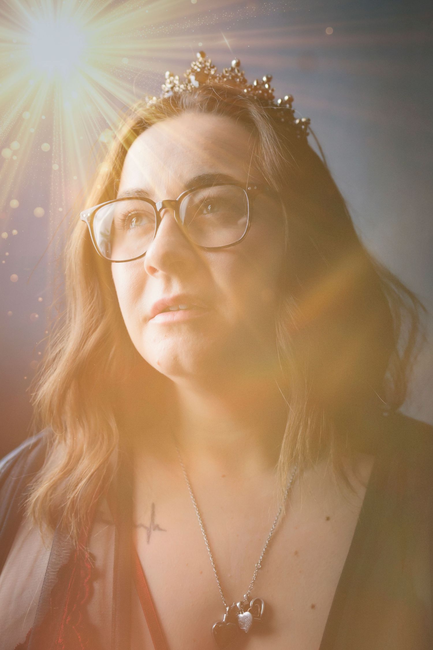 A dreamy sunlit portrait sequence with lens flare showing soft golden lighting and glasses in an ethereal atmosphere.