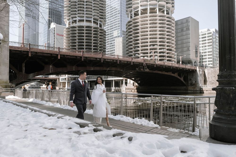A dramatic panoramic view of Chicago's iconic Marina City towers and surrounding modern skyscrapers along the river.