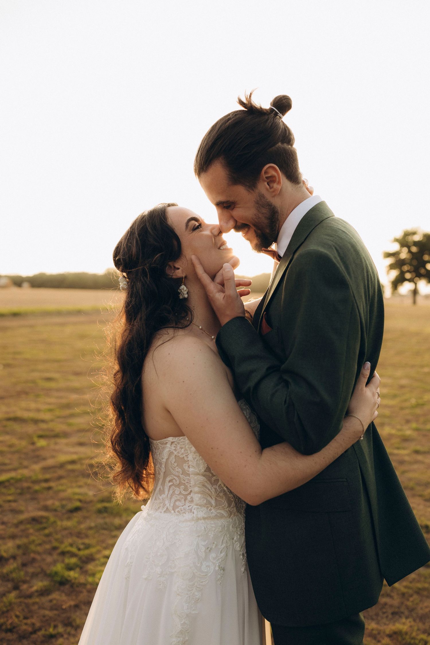 A tender autumn embrace captured during a wedding photoshoot with fall foliage.
