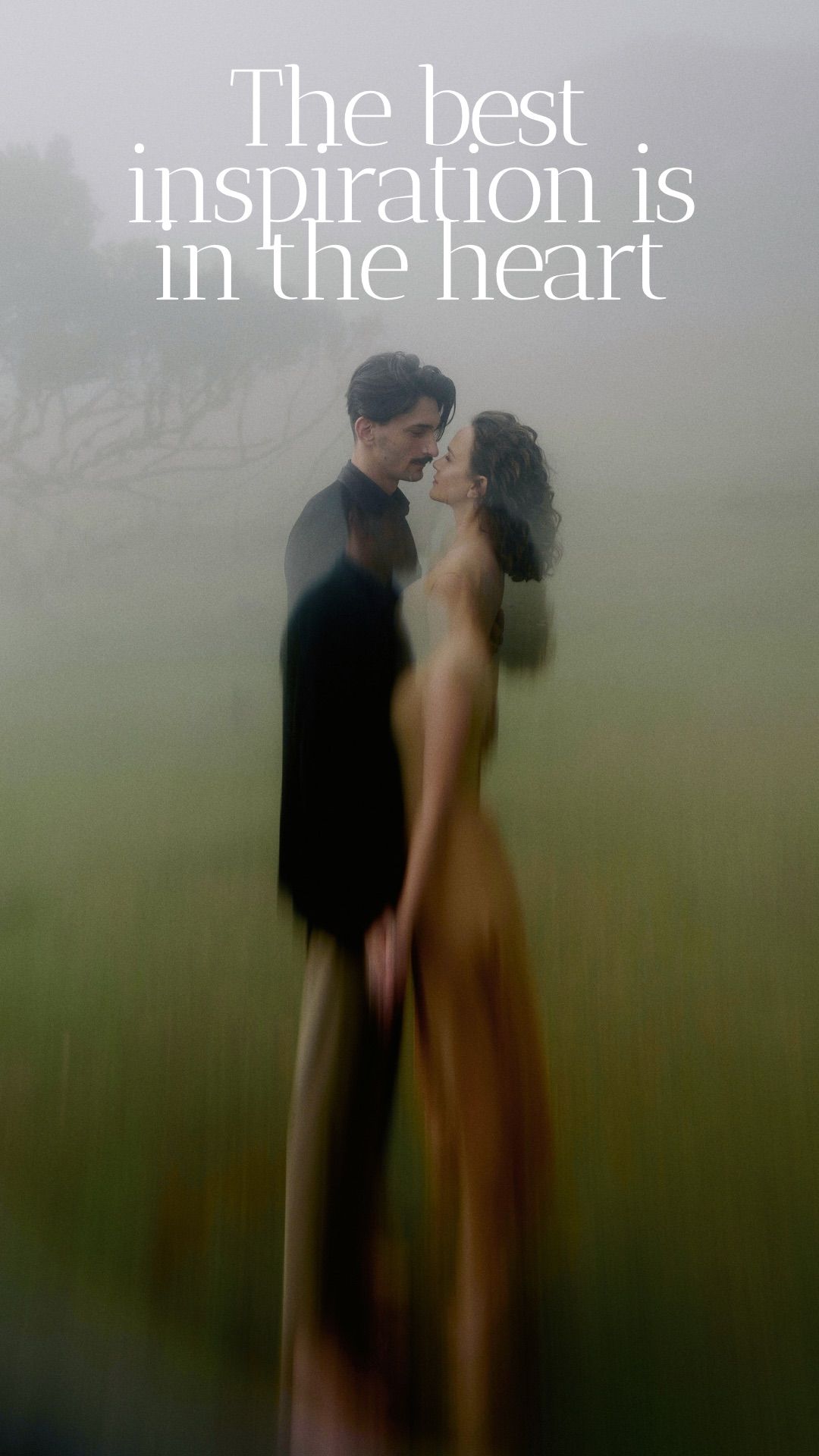 A romantic couple embraces in a misty scene with text reading 'The best inspiration is in the heart'.