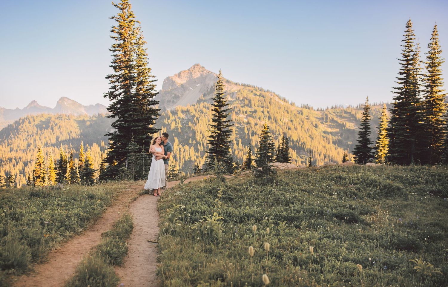 Engagement couple kissing together during their adventure family photo session in Mt. Rainier National Park near Seattle Washington
