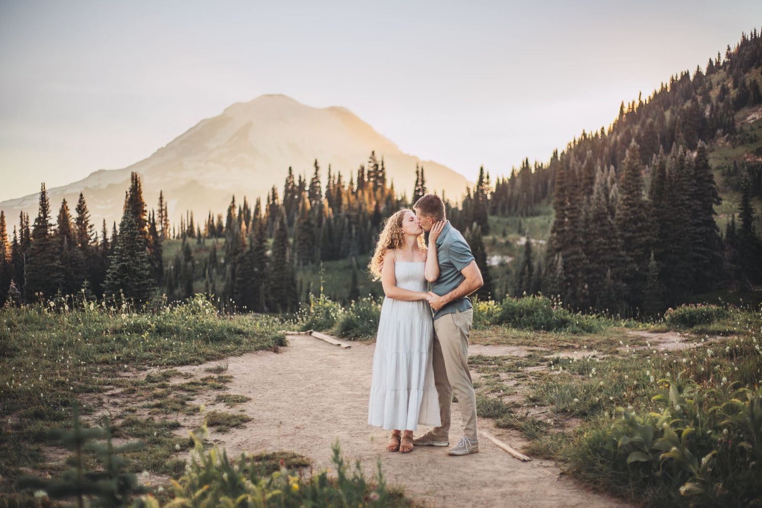 Engagement couple kissing together during their adventure photo session in Mt. Rainier National Park near Seattle Washington