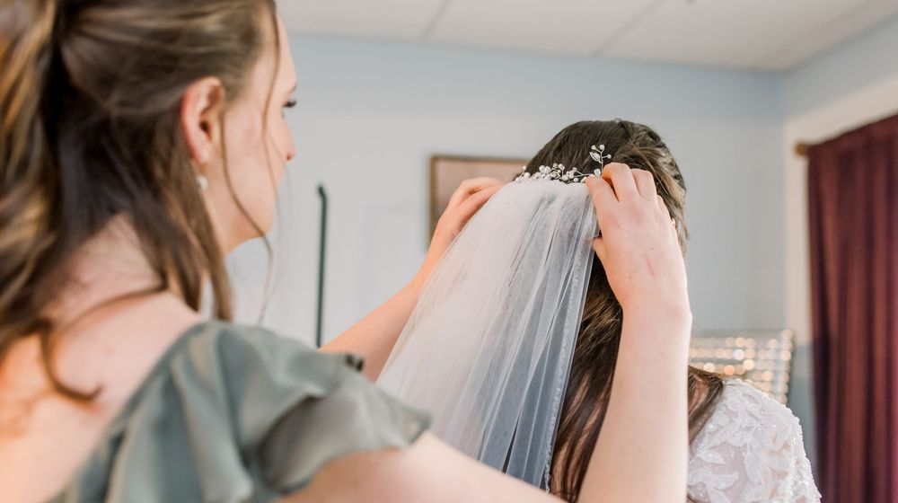 Close-up detail shot of wedding preparations in an indoor setting.