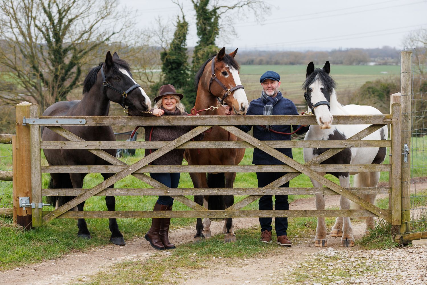 A series of seven photos showing a white horse and rider interacting at a wooden fence in an outdoor setting.