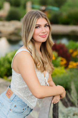 A sequence of casual outdoor photos featuring someone in a white lace top and jeans against a garden background.