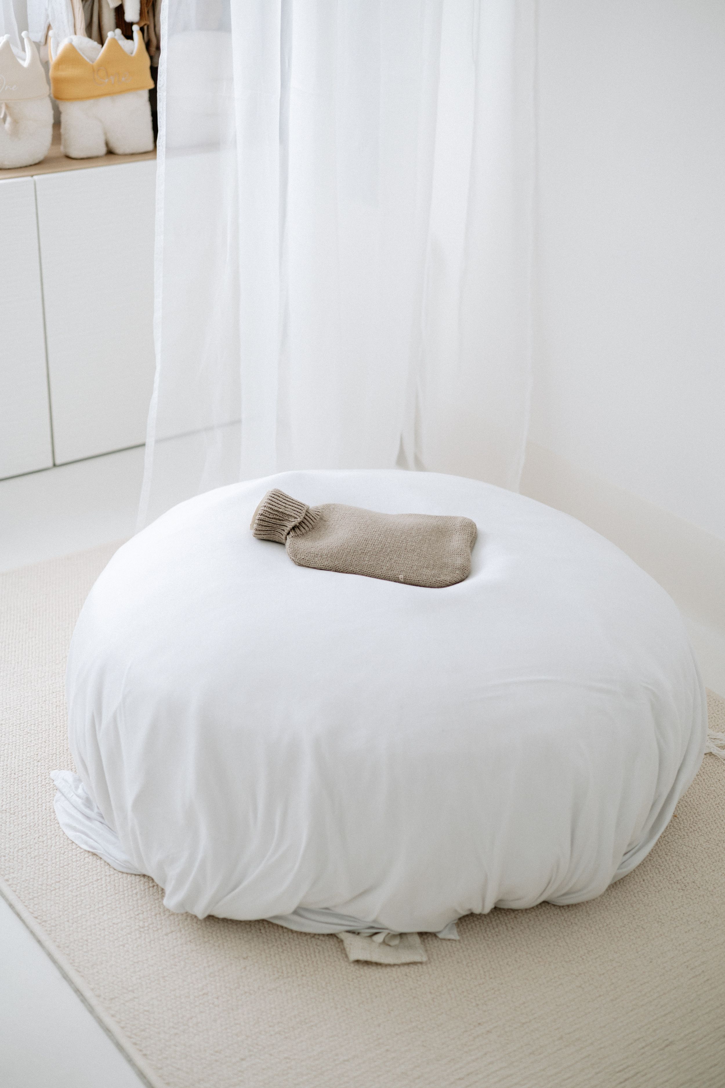 Newborn photoshoot Nottingham natural light cosy home studio newborn posing bean bag