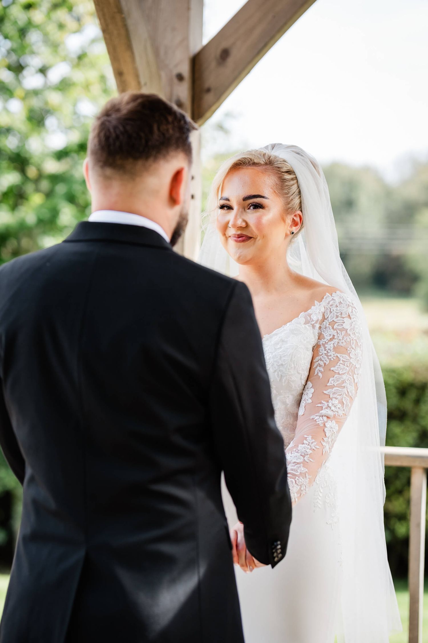 bride laughs and smiles at the groom