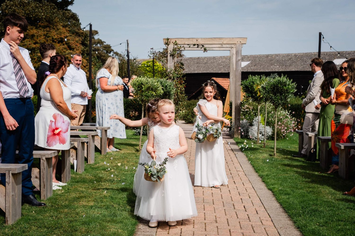 flower girls walking up the aisle