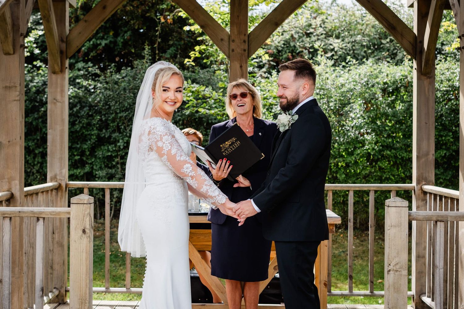 bride and groom at a wedding holding hands at reach court farm dover