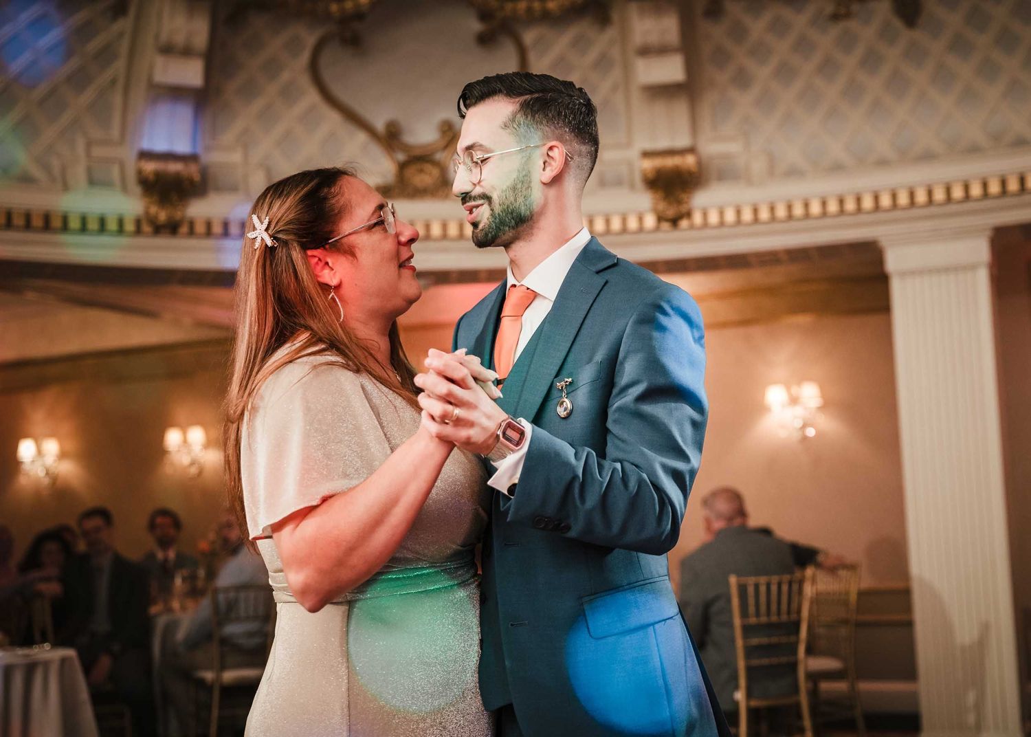 Groom sharing an emotional mother-son dance with his mother during the wedding reception at the Lenox Hotel Dome Room in Boston