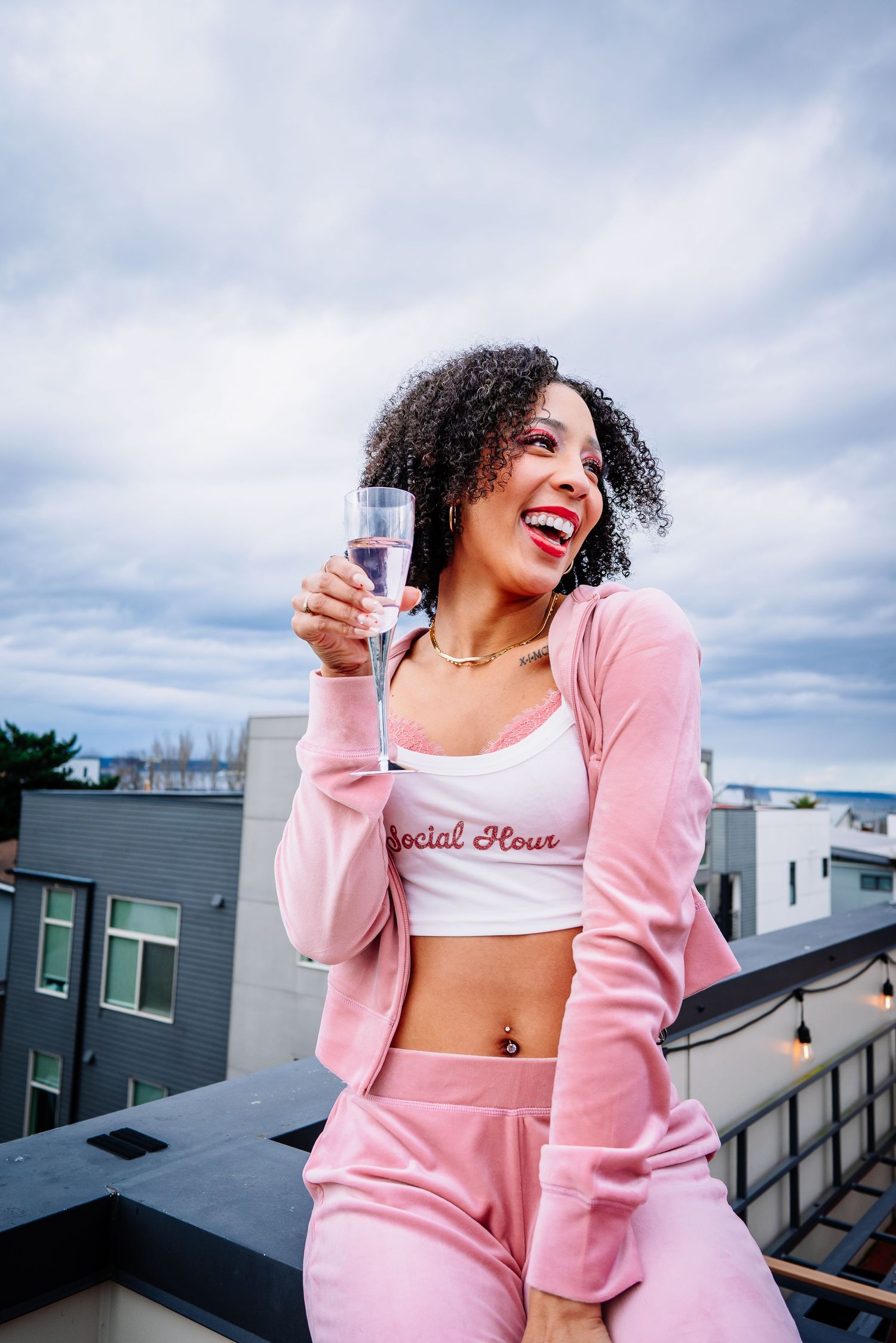 Seattle branding photography session featuring entrepreneur portrait on rooftop with city skyline