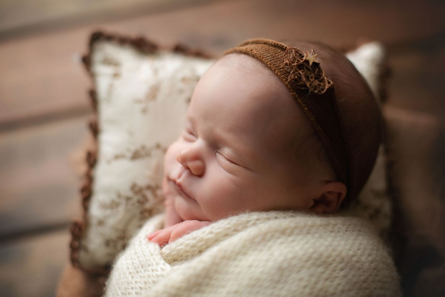 A newborn on brown pillow. Greenville sc newborn photographer, Easley sc newborn photographer, Upstate sc newborn photographer
