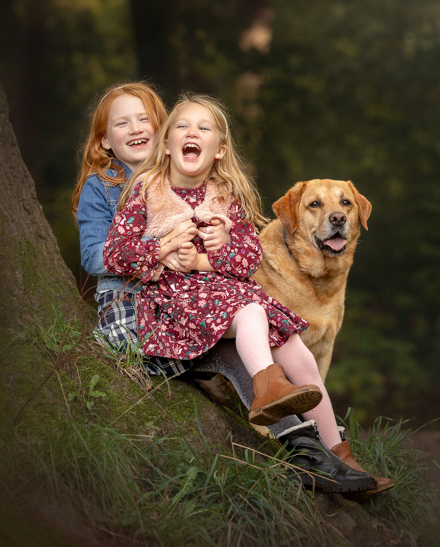 girls giggling by the tree at Bramhall Park with their labrador dog, family and pet photography