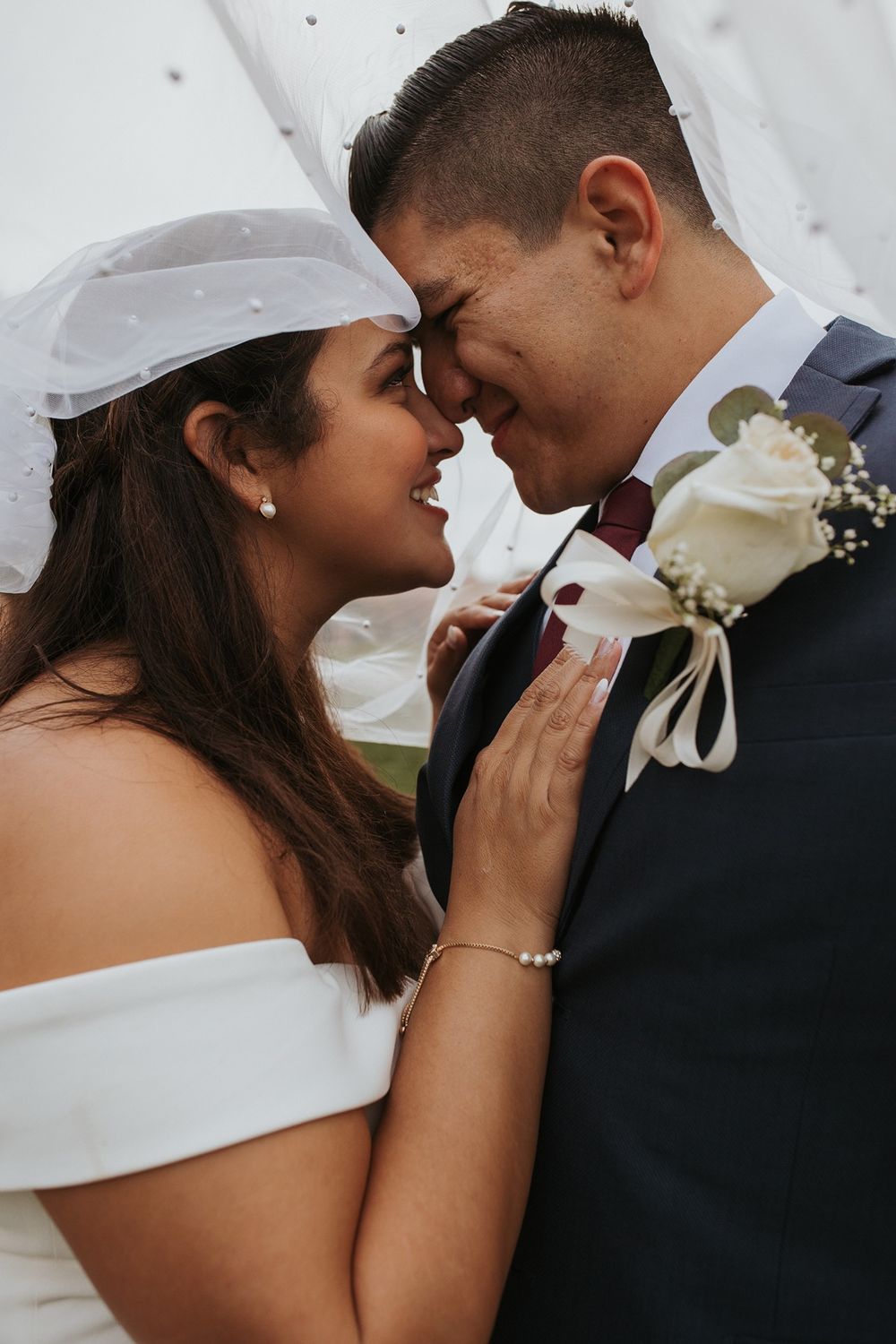 A romantic wedding couple shares intimate moments in a series of close-up photos showing tender embraces.