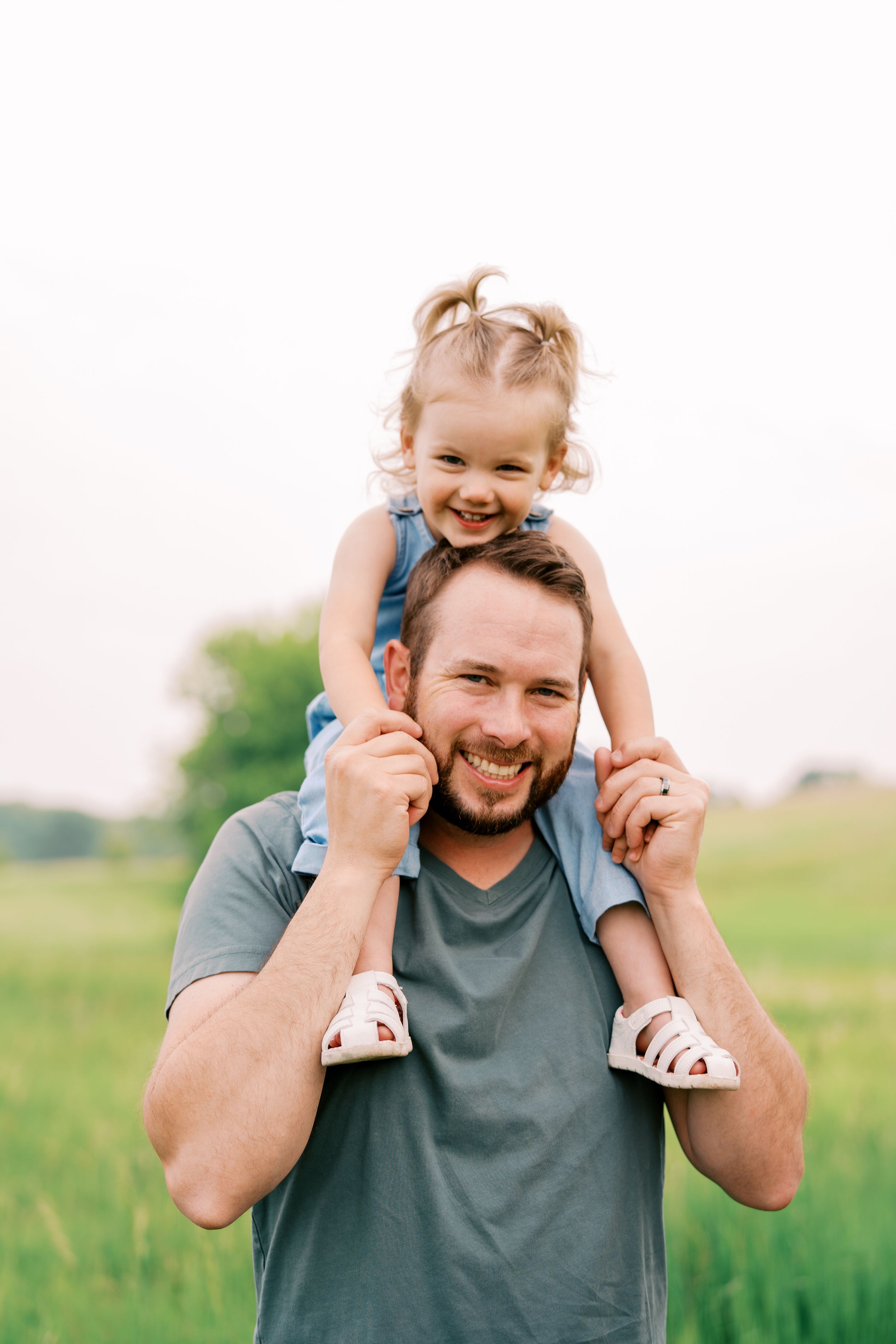 Playful moments captured in a series of photos showing joyful interactions in a sunny green field.