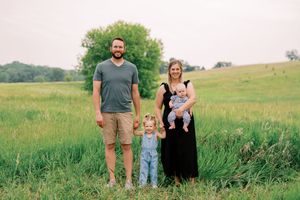 A series of outdoor family portraits taken in a lush green meadow during golden hour.