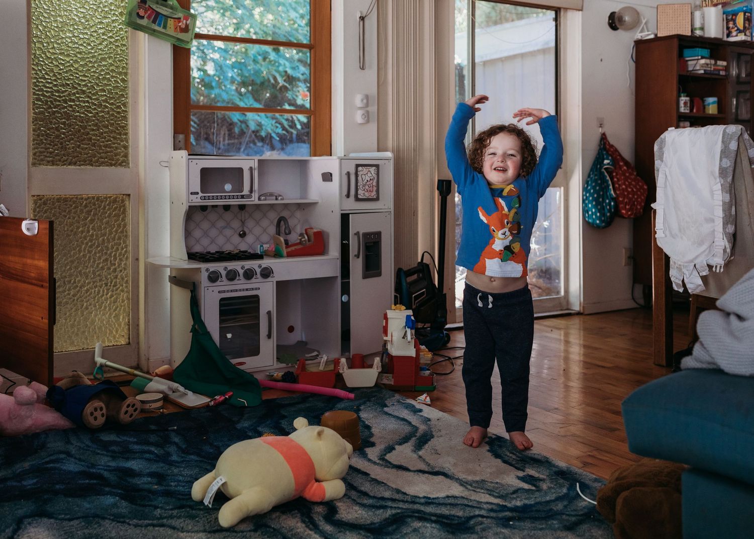 A sequence of photos showing someone doing yoga and stretching exercises on a mat in a home setting.
