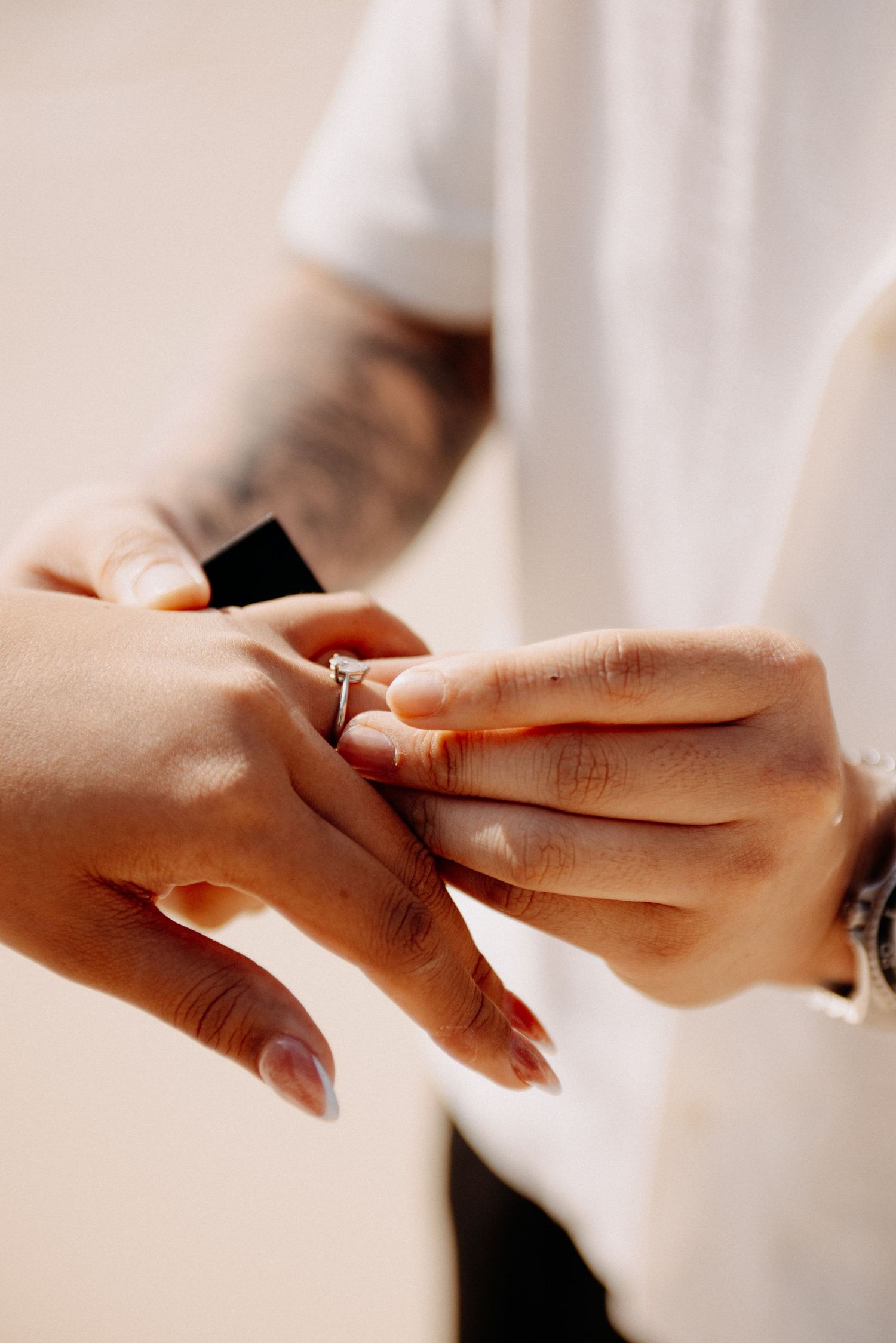 A romantic beach proposal sequence showing a couple during a special moment on the sandy shore.