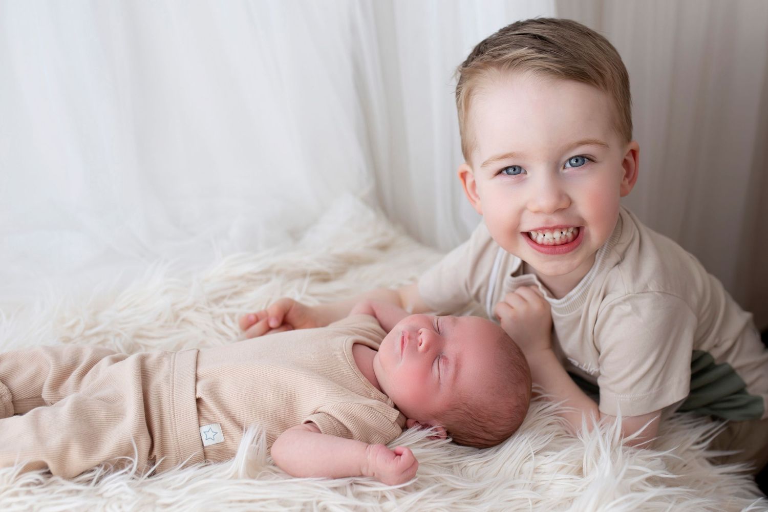 Newborn photoshoot brother and baby by Little Wonderland Photography Widnes Cheshire