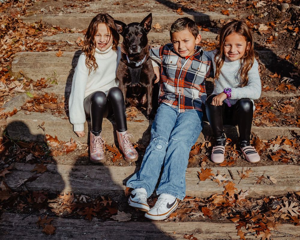 Sequence of cropped photos showing children's legs and feet sitting on wooden steps covered in autumn leaves.