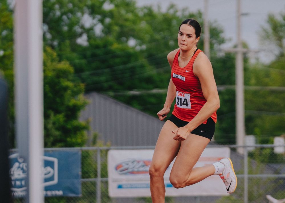 Sports Photography of high jumper running towards pit competing in track event - Warsaw, Indiana