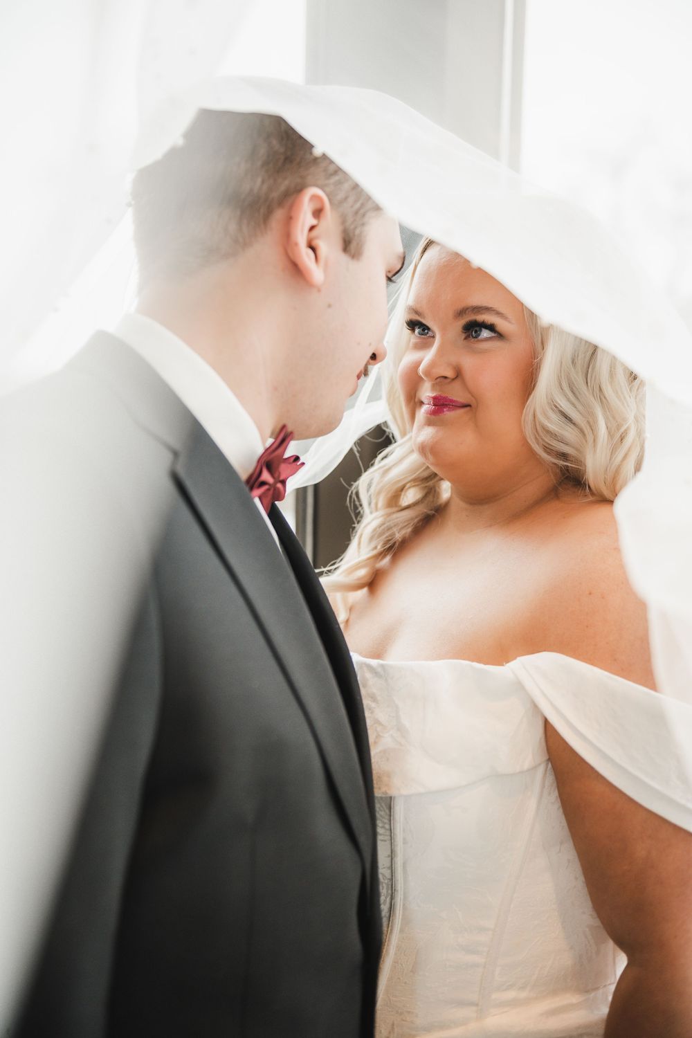A romantic wedding moment captured in a series of intimate close-up shots showing the couple in white and black attire.